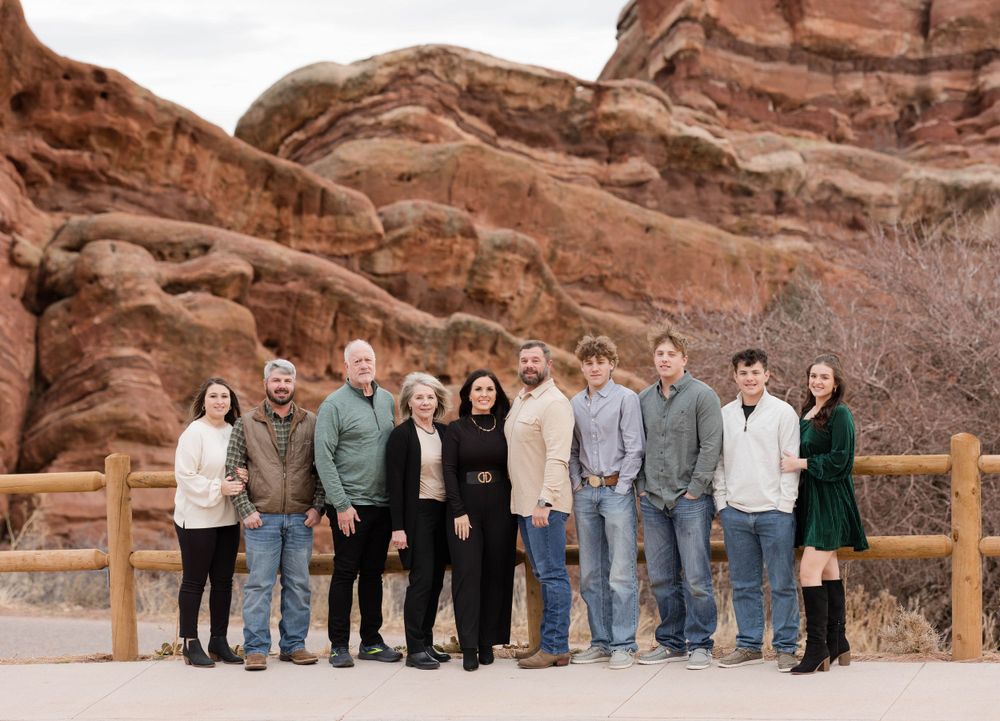 Family group portrait against the stunning backdrop of Red Rocks natural amphitheater.