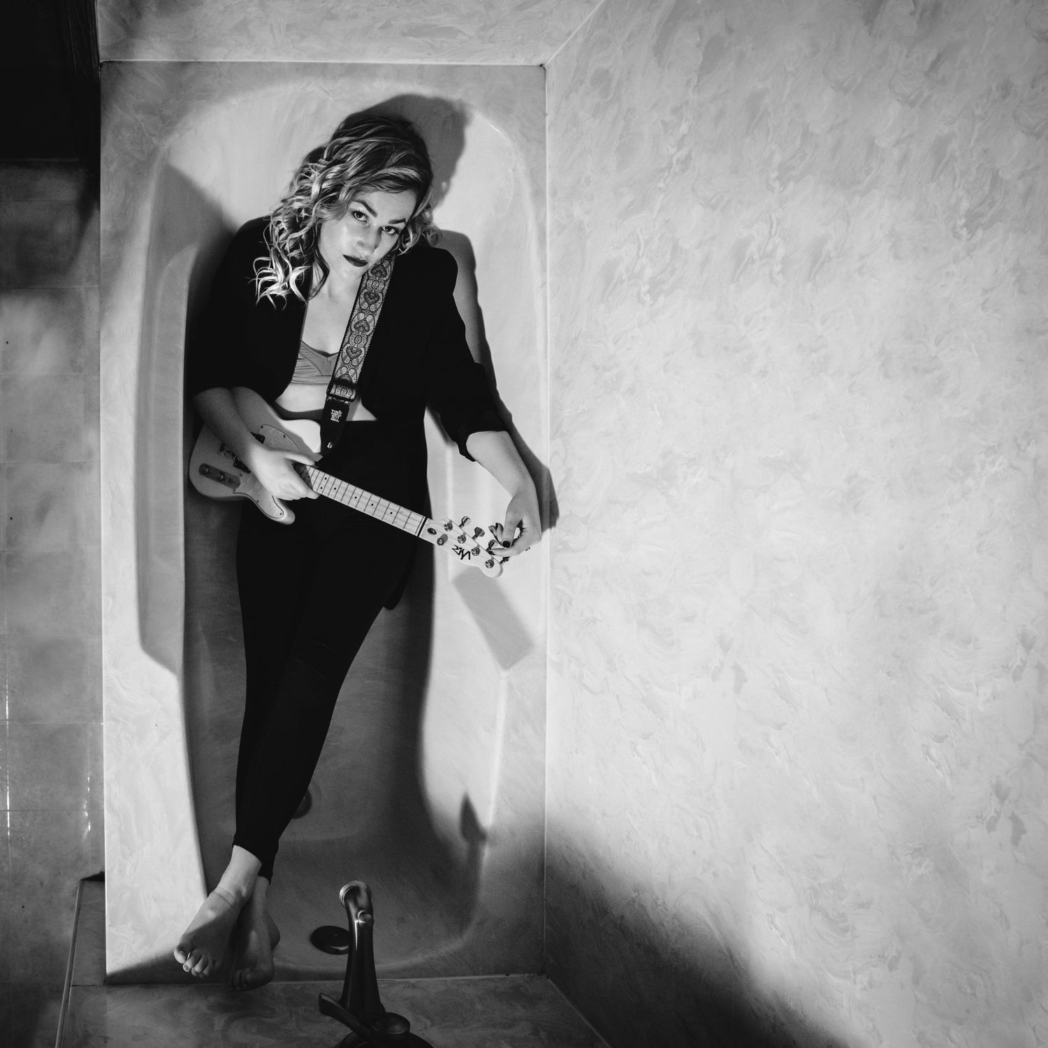 Beautiful black and white editorial photography; musician in bathtub; album cover; album artwork; Clarissa Anello