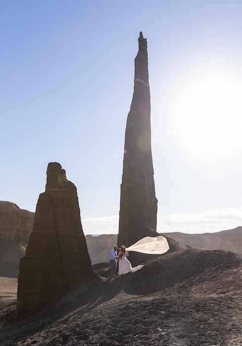 Ancient Buddhist stupas cast dramatic shadows across the desert landscape at sunrise in Turpan, China.