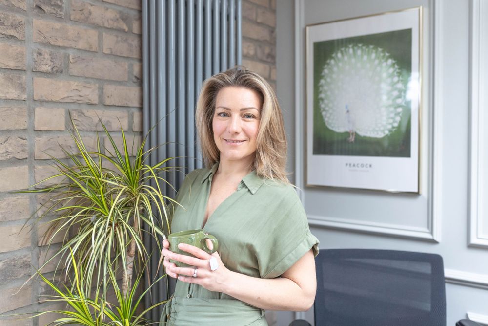 personal branding photographyof A THERAPIST HOLDING A CUP OF TEA