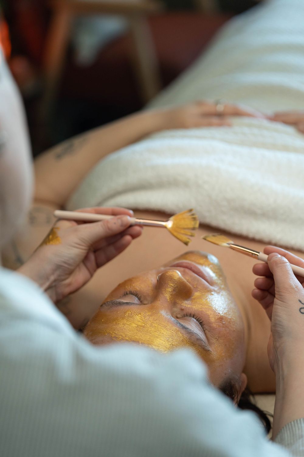 women receives a holistic facial in personal branding shoot in brighton