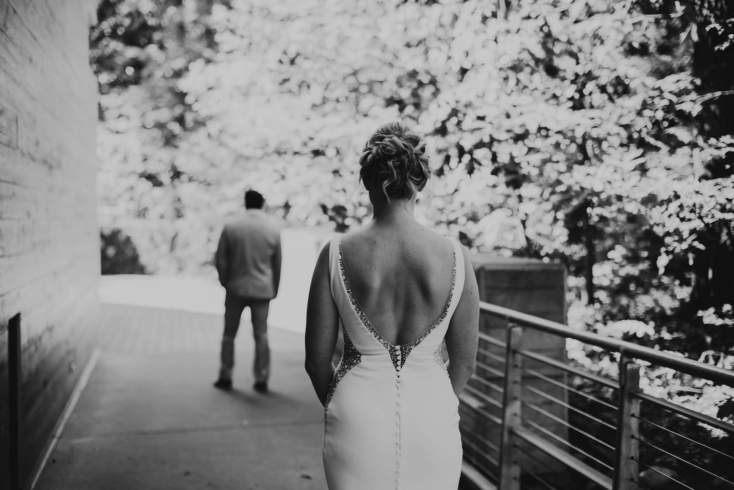 A black and white collage of intimate wedding moments showing couple embracing and walking together outdoors.