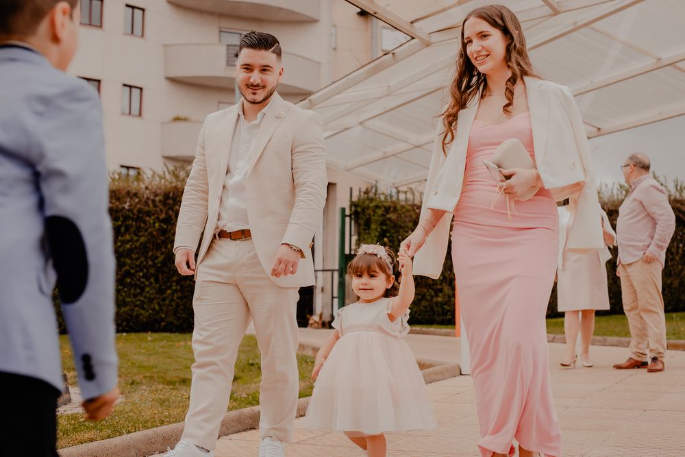 An elegant outdoor gathering with people in formal attire during a special celebration.