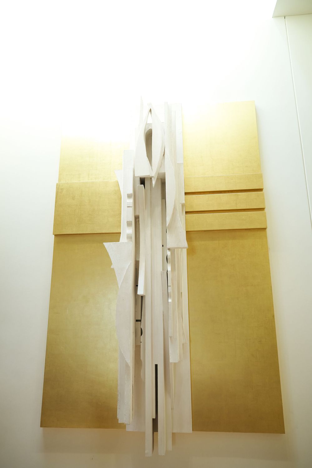 White paper artwork installations hanging on a gallery wall in sequence. Siant peters church