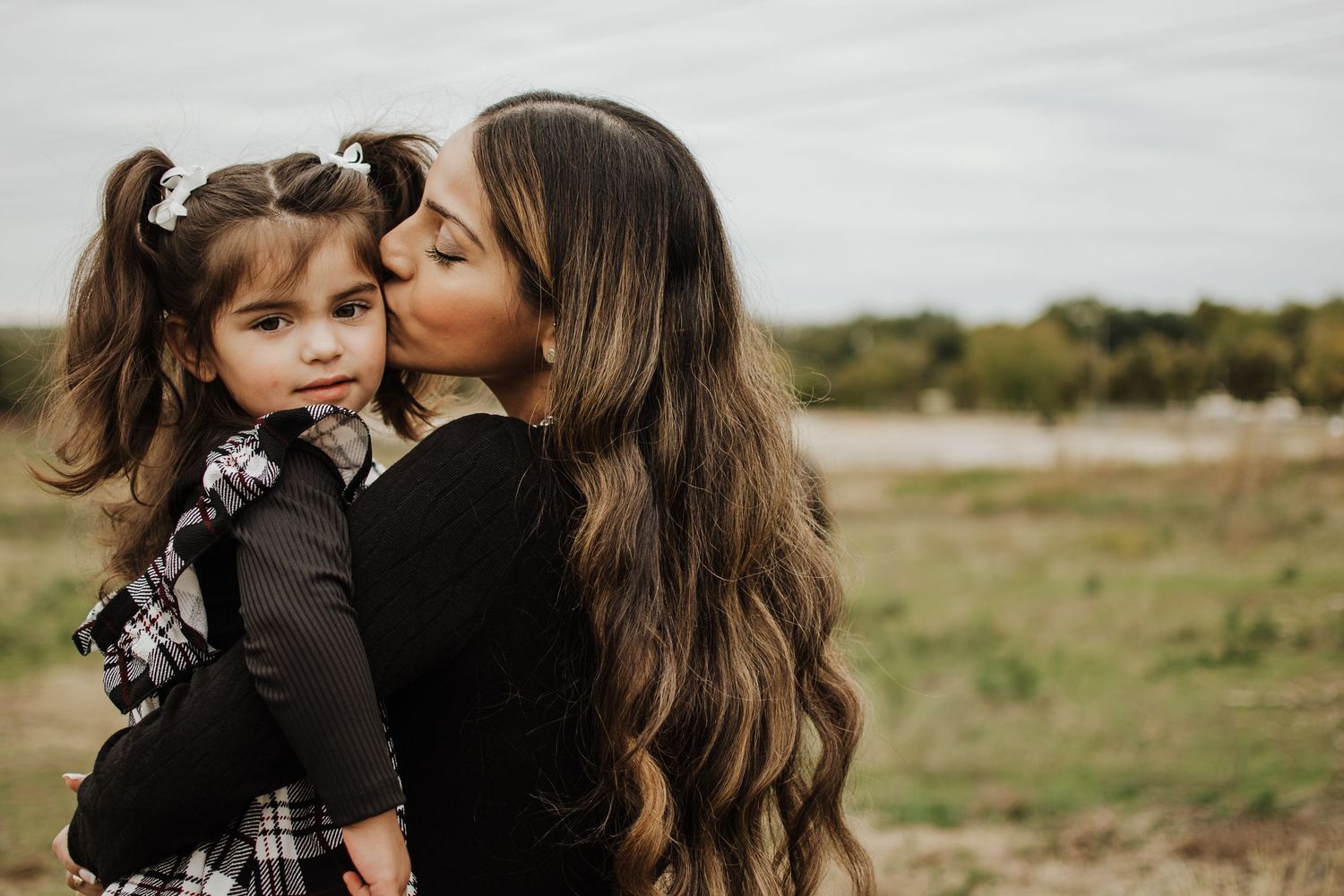 A touching outdoor family moment captured in warm natural light. Crowley Family Photographer
