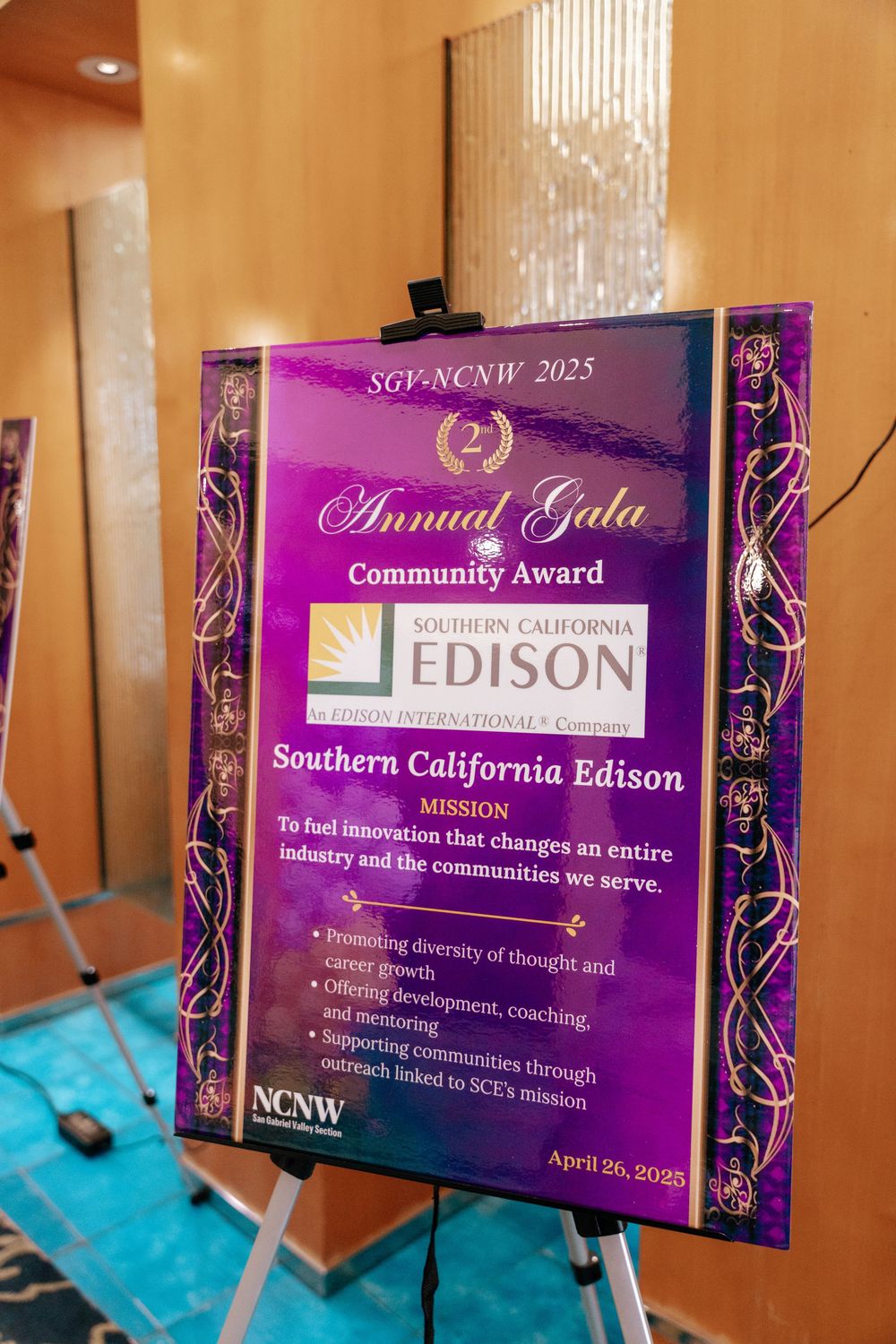 A purple and gold award plaque from NCNW 2023 Annual Gala recognizing Southern California Edison's community service.