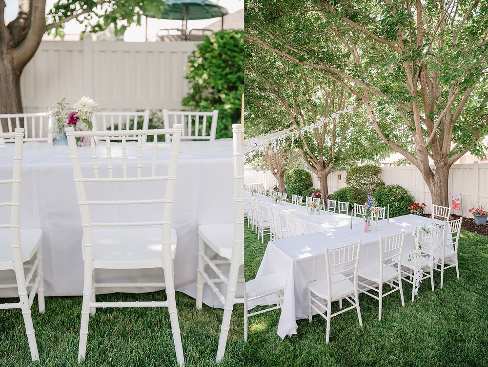 White chiavari chairs with elegant white cushions arranged in rows on a manicured lawn for an outdoor wedding ceremony.