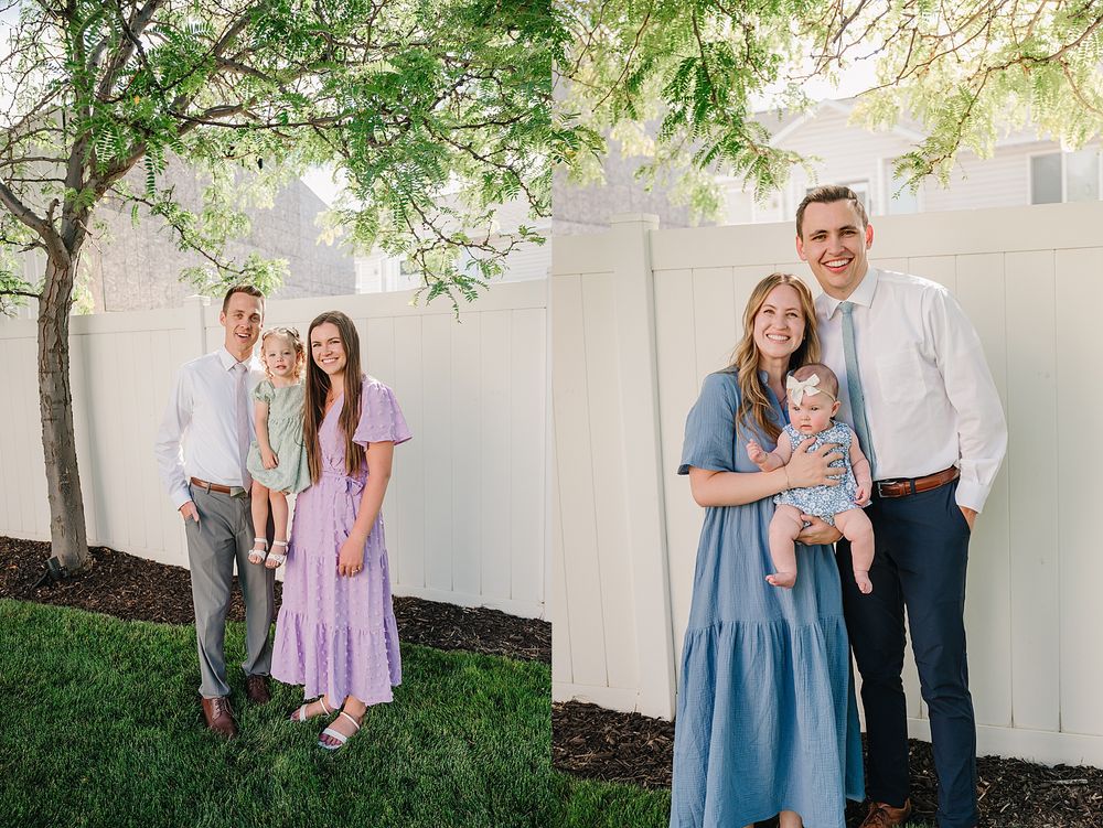 Family portrait outdoors with people wearing casual pastel outfits standing against a white wall with overhanging tree branches.