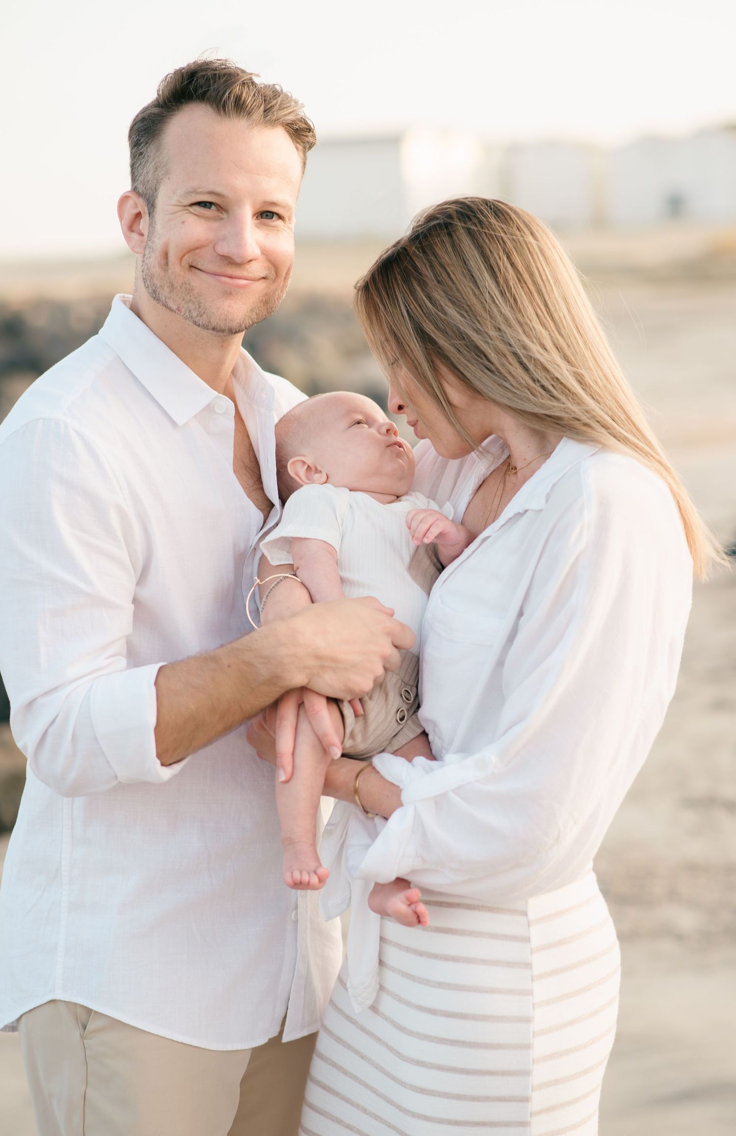 Jersey shore couple hires New Jersey family photographer to capture their son's first weeks with photos on deal beach in New Jersey.