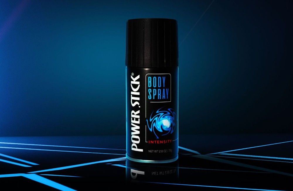 A spray can of Power Stick anti perspirant body spray against a dark blue background with glowing blue lines.