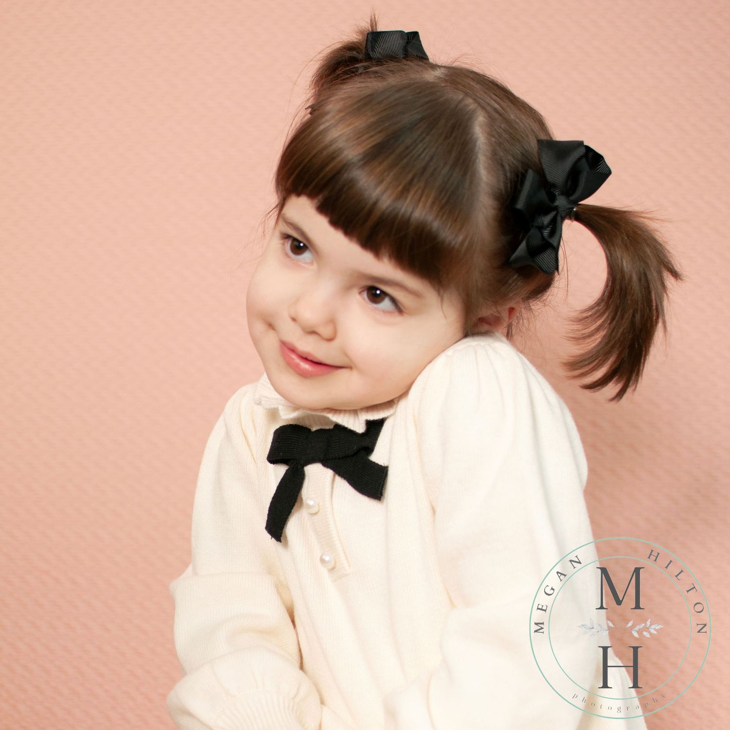 Toddler tipping her head to her shoulder image