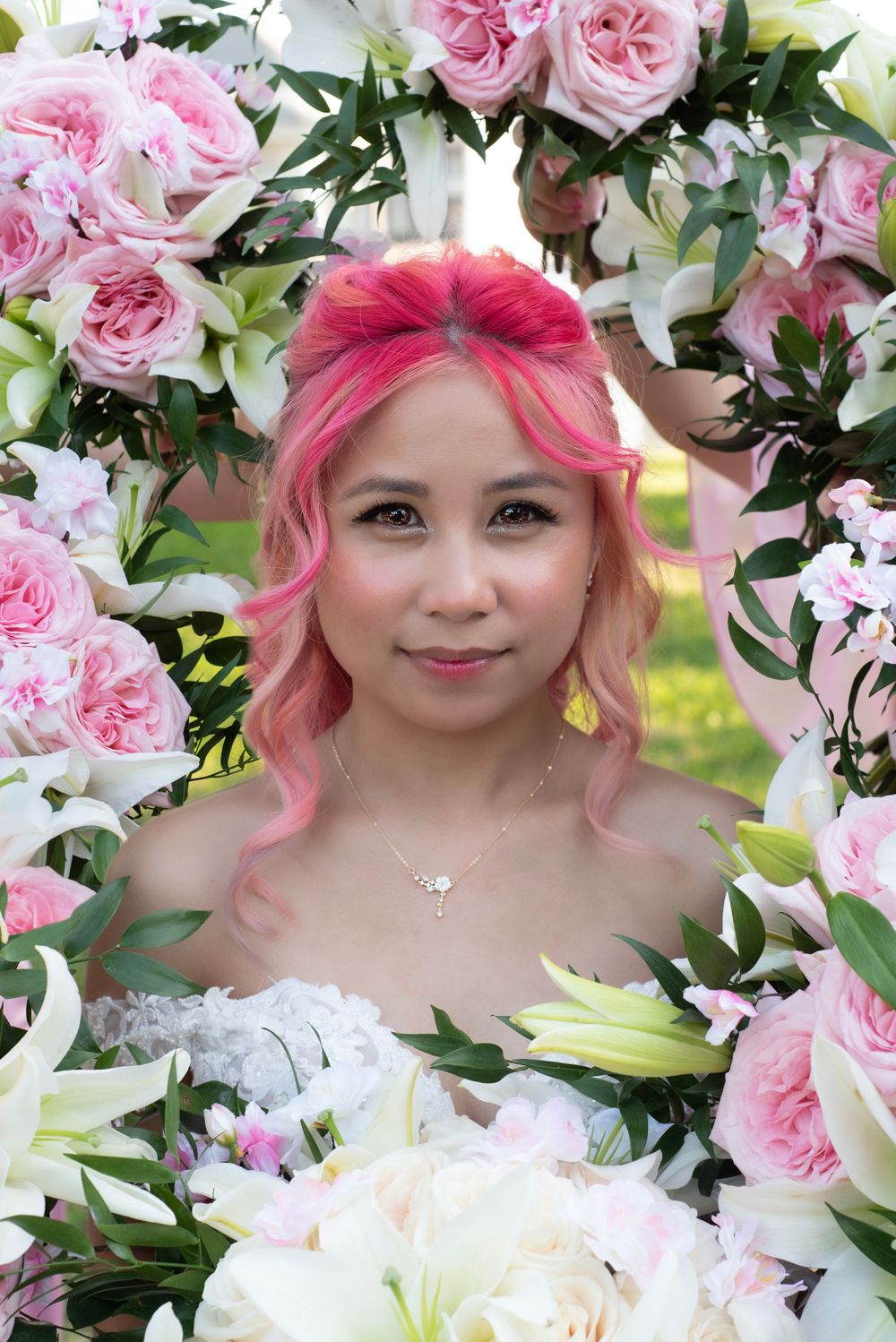 Bright Pink solo wedding event portrait photo of bride surround by bridal party bouquet. Bridal party bouquet trend.