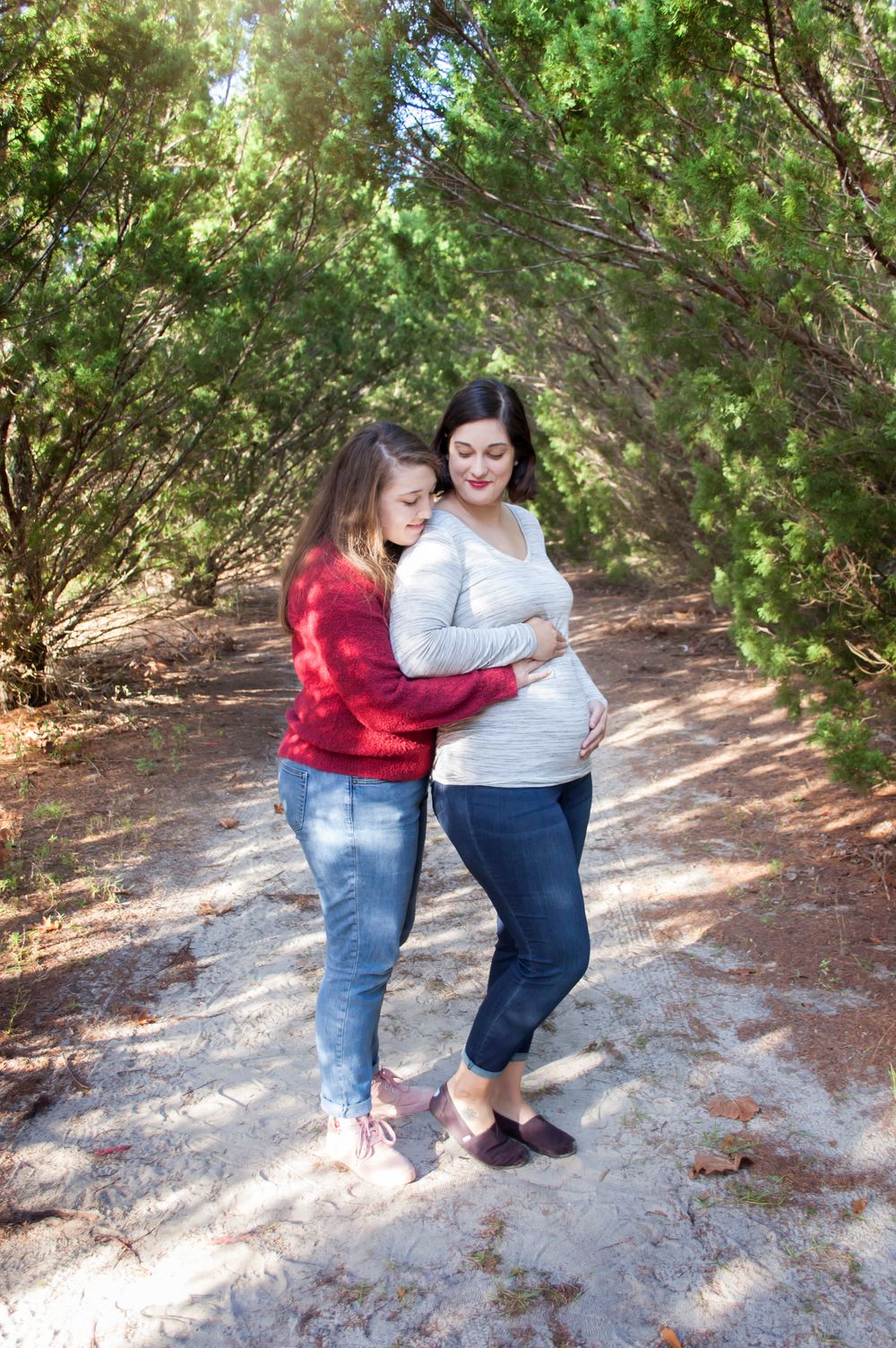 Duo same sex lesbian maternity session baby boy on the way. Natural lighting nature trail neat Santa Fe College in Gainesville Florida