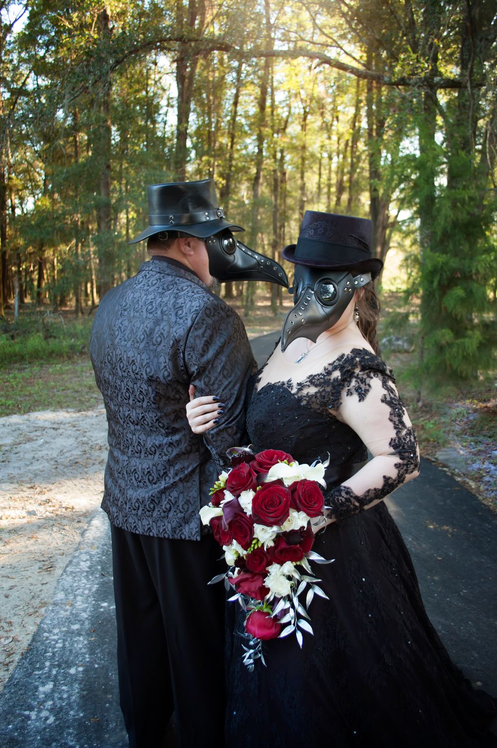 Duo wedding event portrait session during golden hour black wedding dress in Gainesville Florida. Plague doctor mask themed