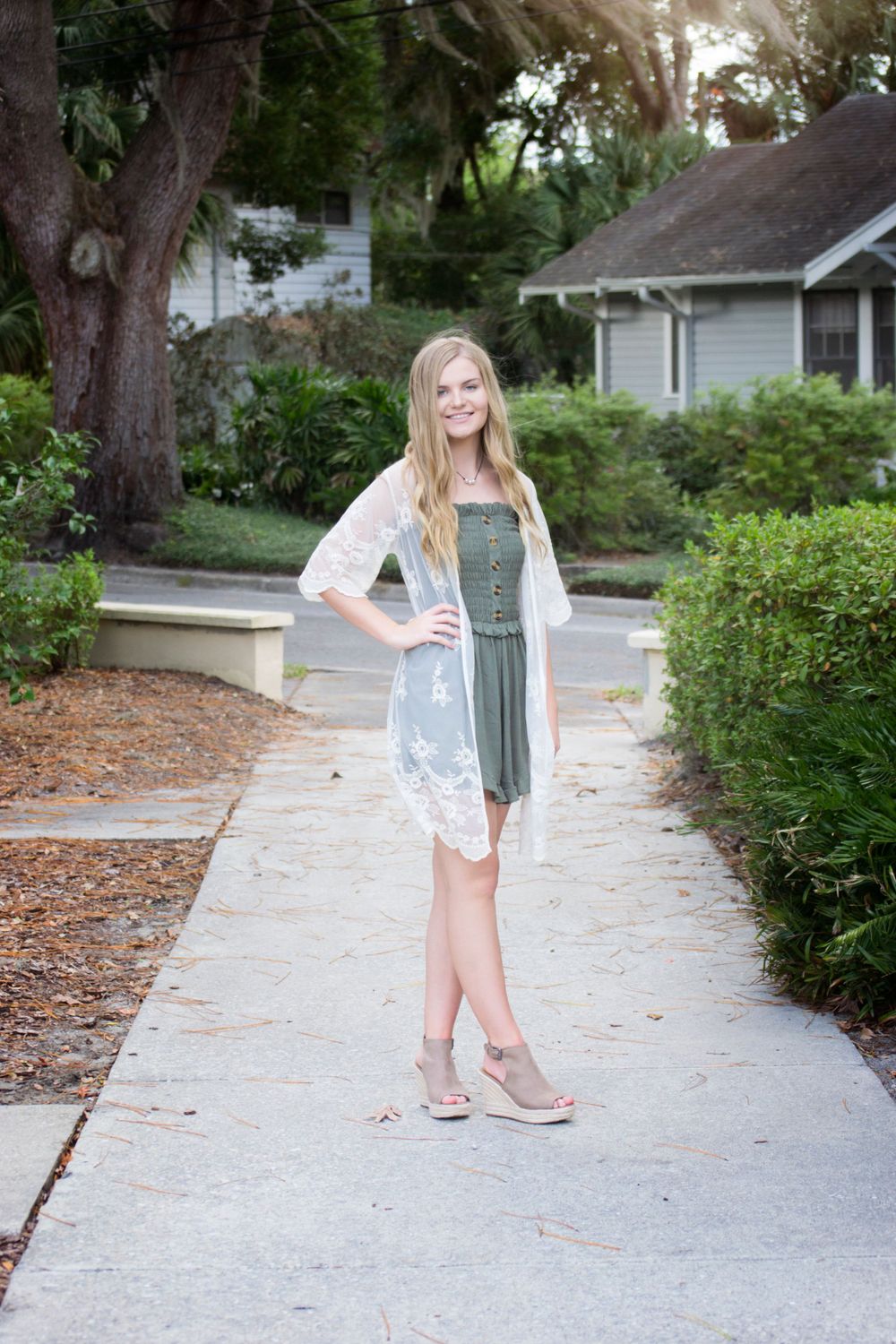 Solo female senior high school grad session excitement. Soft afternoon natural lighting in Gainesville Florida at the Thomas Center