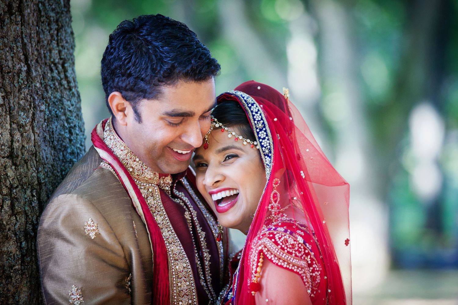 Wedding portrait of an Indian bride and groom in traditional Indian wedding attire