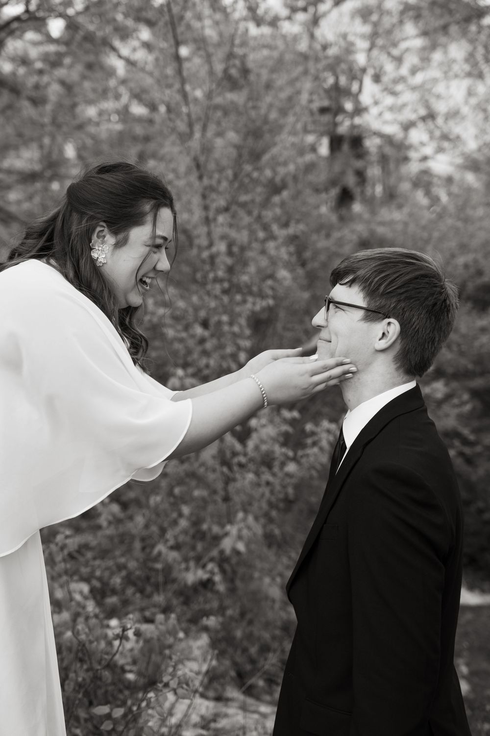 ©AnnaVonRiesenPhotography Bridal Portraits | B&W image of a couple smiling at each other.