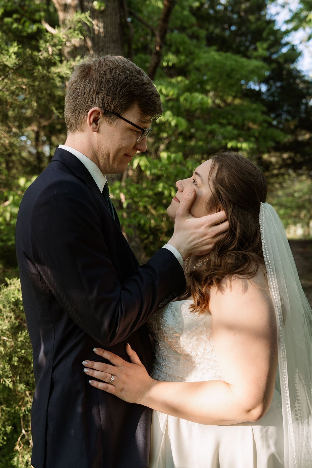 ©AnnaVonRiesenPhotography Bridal Portraits | Color image of a couple smiling at each other.