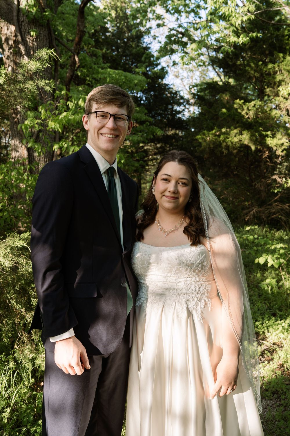 ©AnnaVonRiesenPhotography Bridal Portraits | Color image of a couple smiling at the camera.