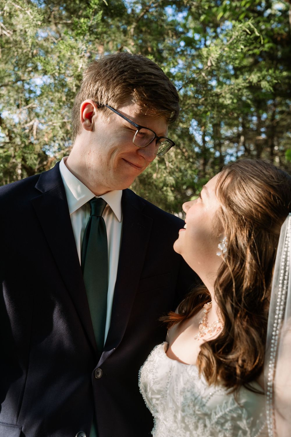 ©AnnaVonRiesenPhotography Bridal Portraits | Color image of a couple smiling at each other.