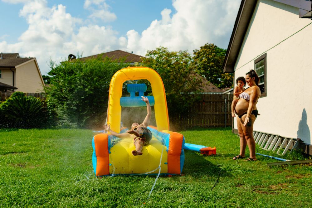 Multiple views of an inflatable water play setup in a residential backyard.