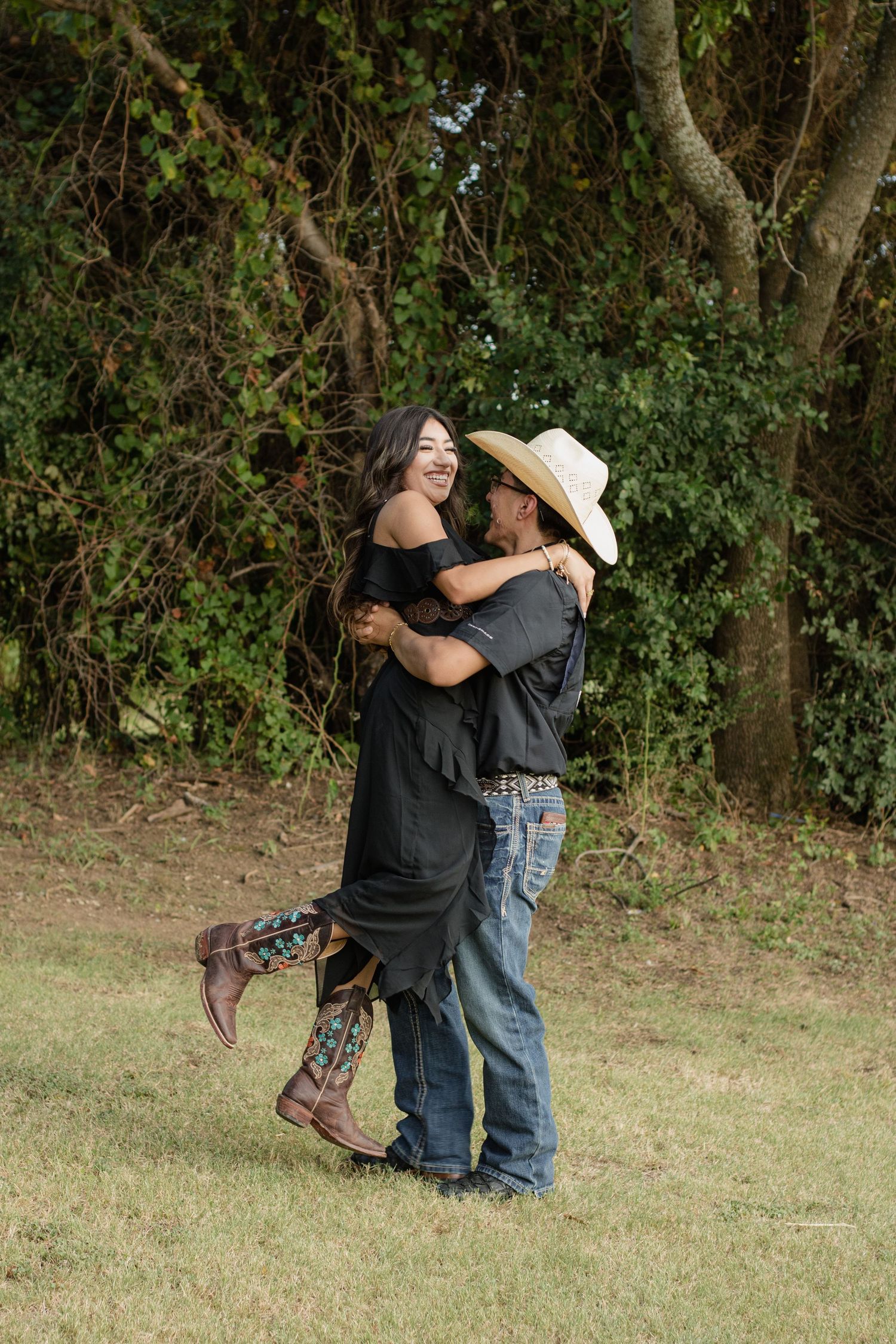 Photo of a couple in a country style photo candidly dancing