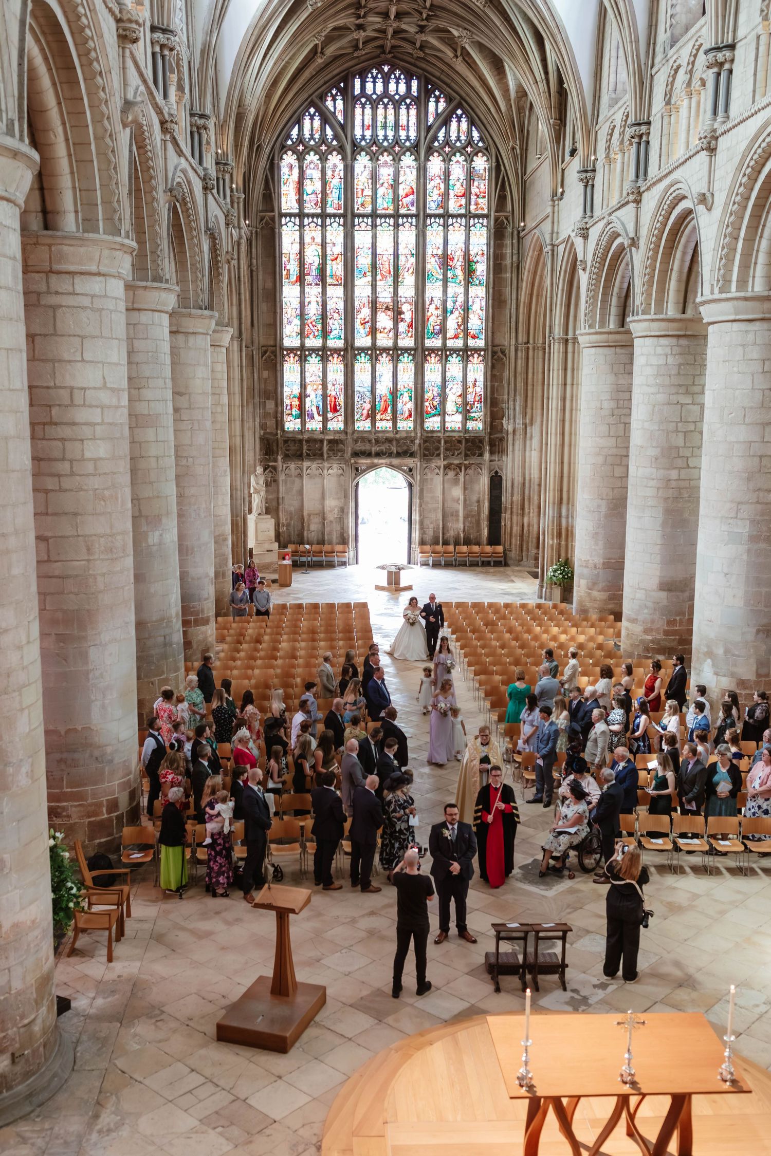 Gloucester Cathedral wedding photographer Gloucestershire Cheltenham Bride walking into the nave