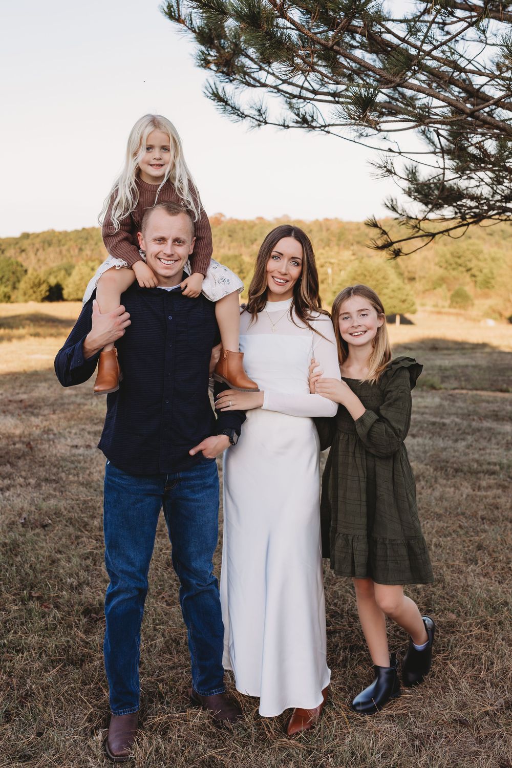 family session fall cream brown neutral tones sisters daughter on dads shoulder