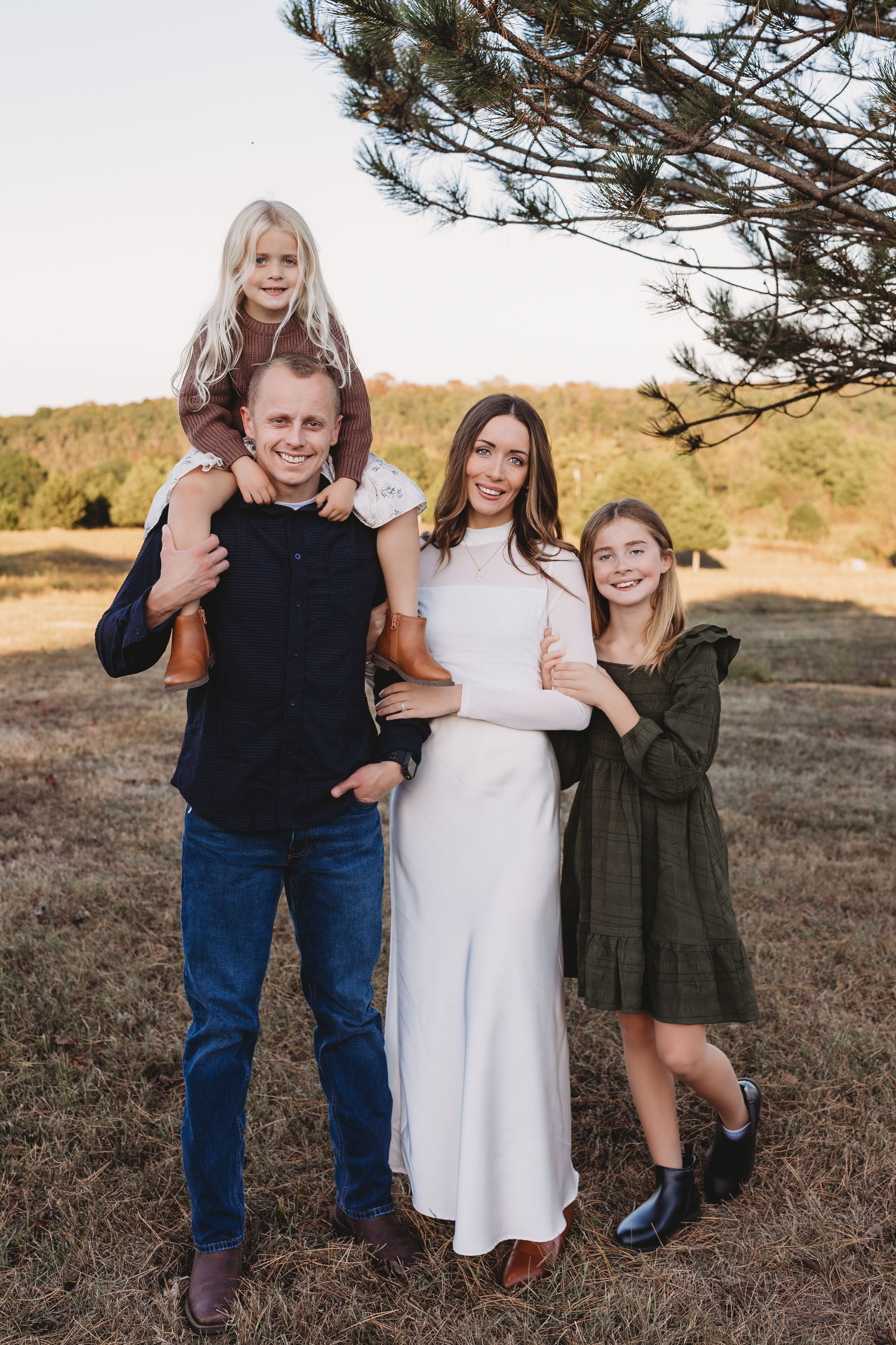 family session fall cream brown neutral tones sisters daughter on dads shoulder
