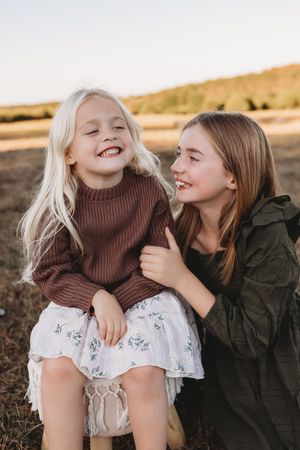 family session sisters laughing blonde hair blue eyes