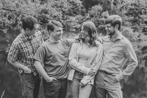 siblings black and white photo 3 brothers 1 sister
