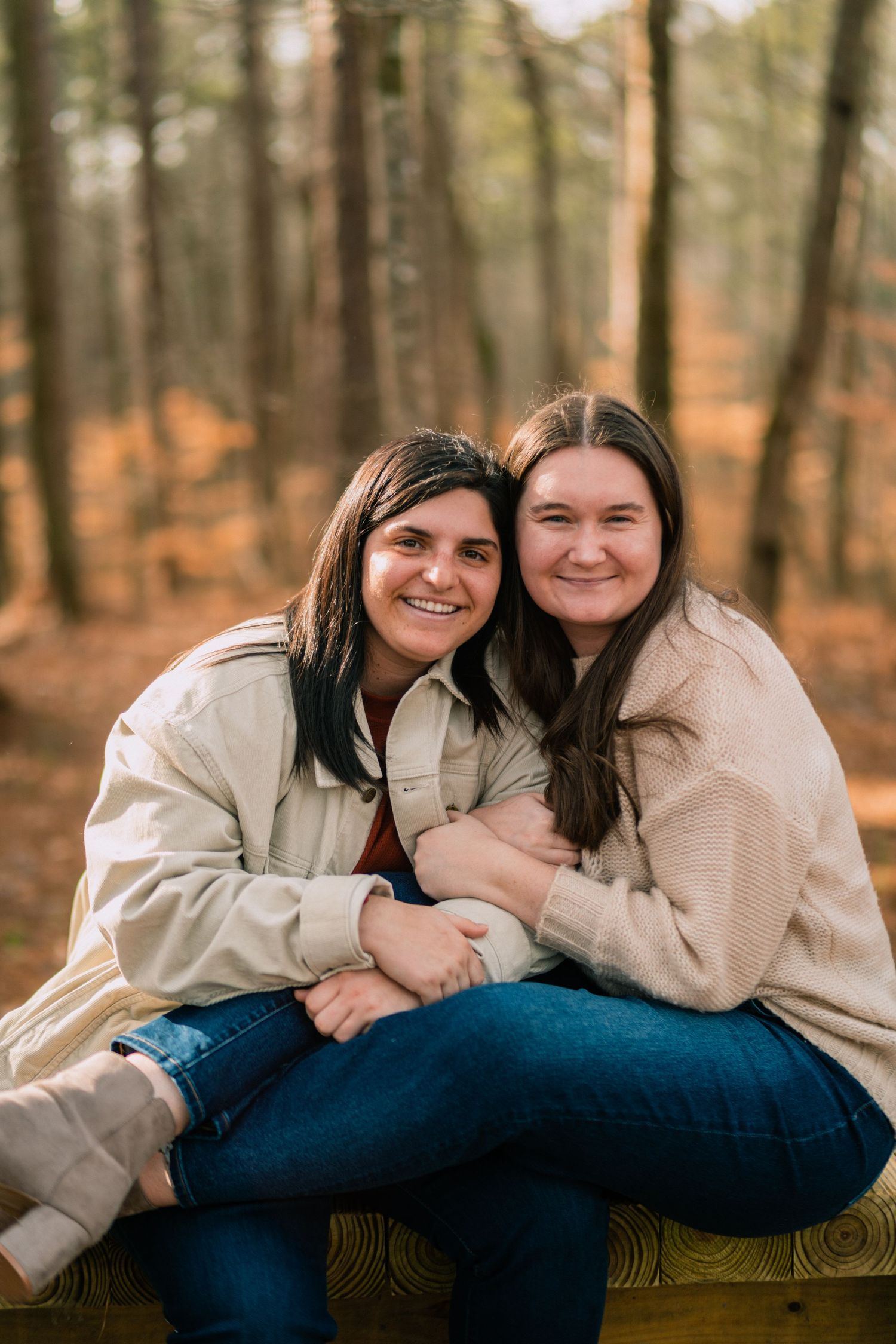 Candid outdoor portrait showing warm connection and matching outfits.