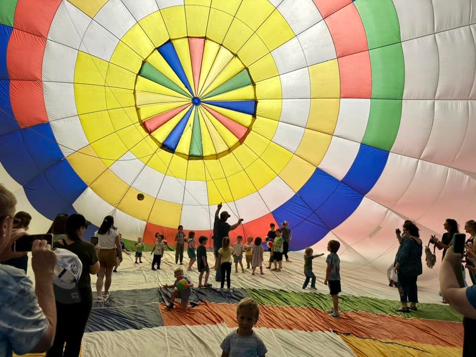 Students play inside the balloon envelope while learning how it flies and operates—an exciting hands-on class event!