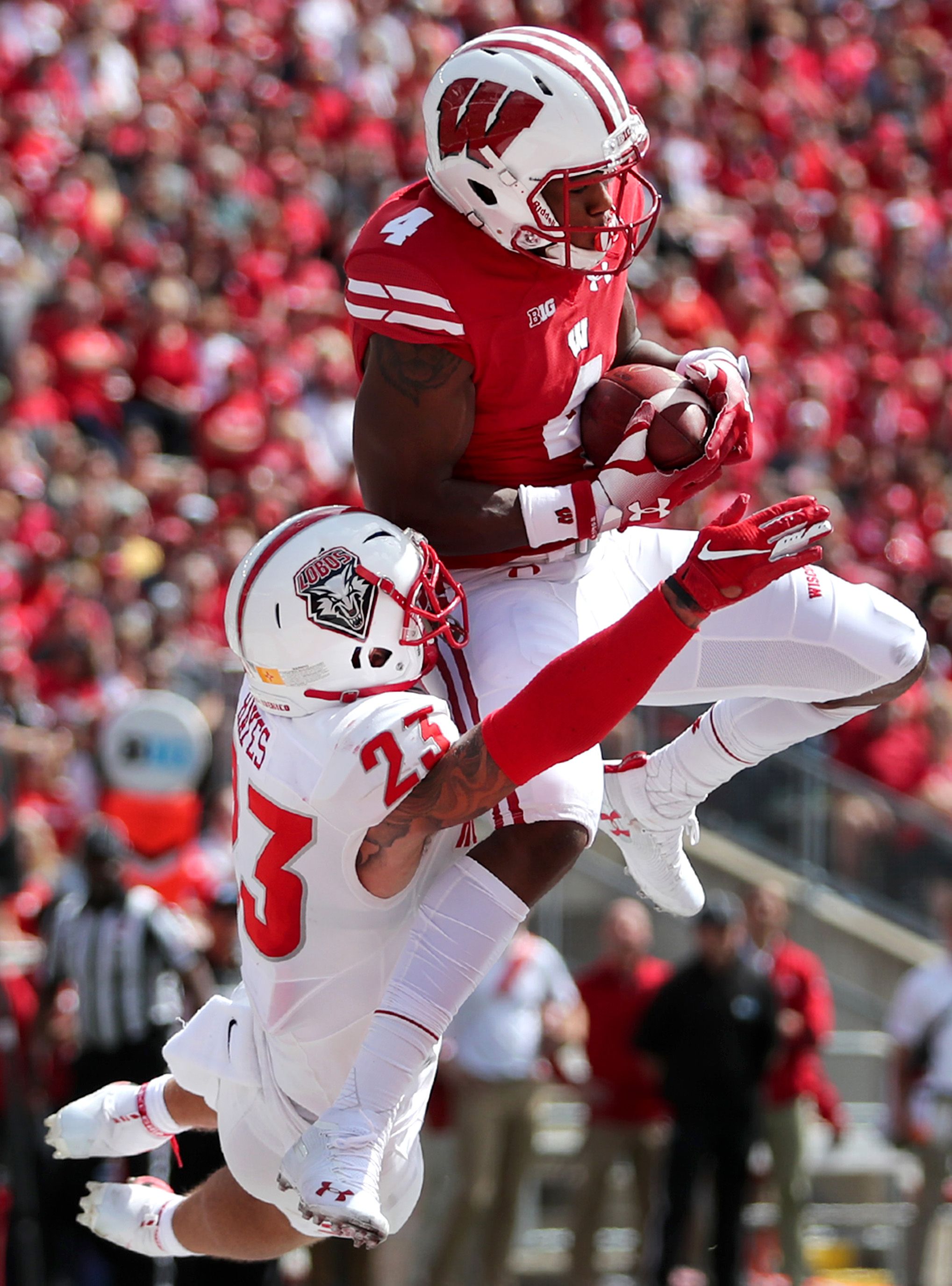 A University of Wisconsin football players makes a catch.