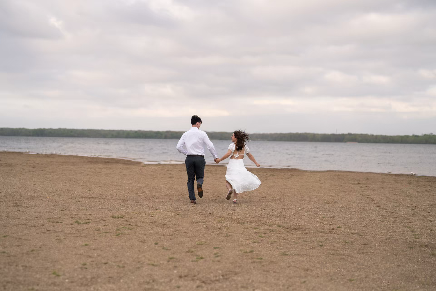 joyful engagement photo at Alum Creek Beach