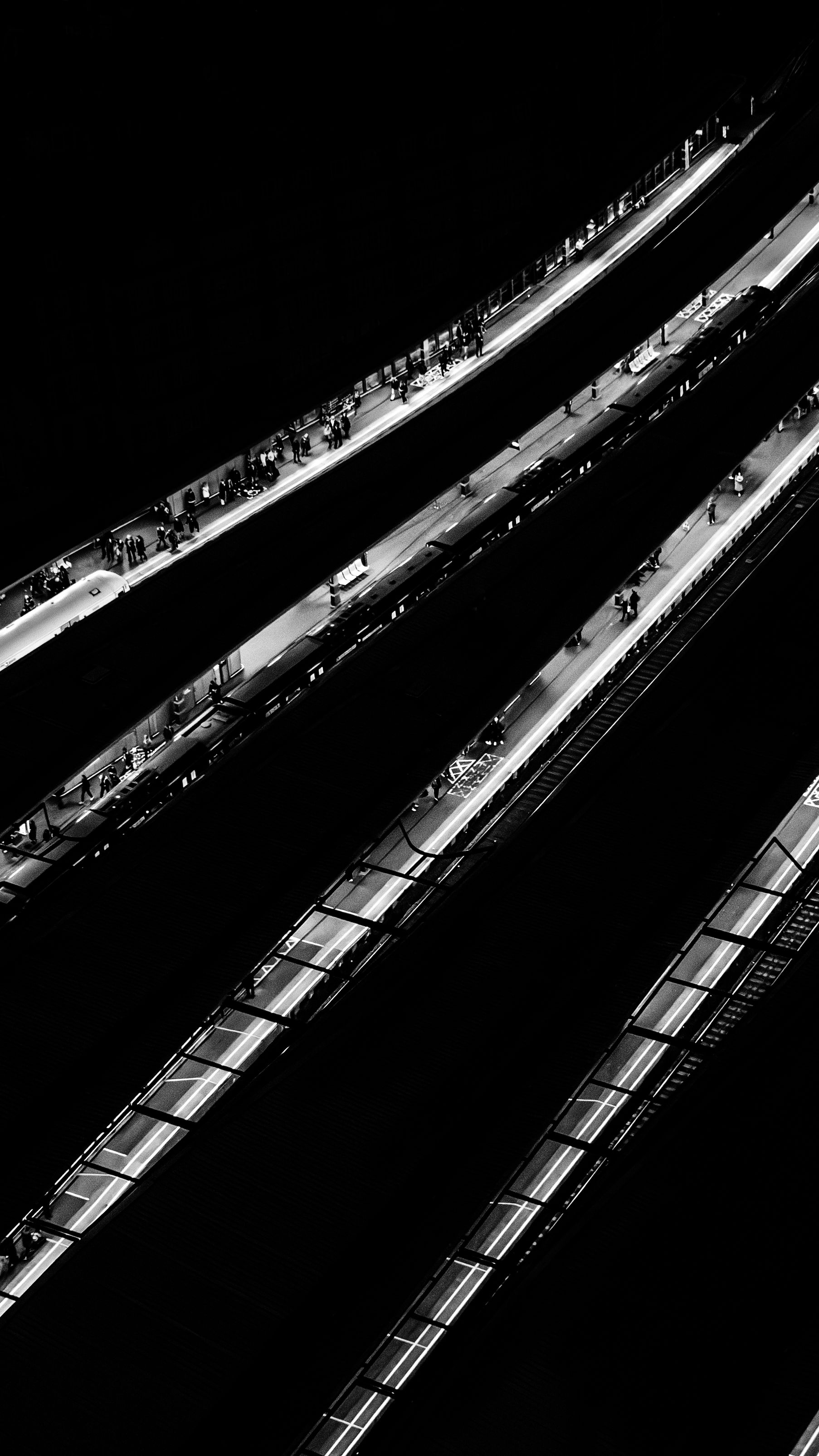 Abstract black and white photo of diagonal light streaks, minimalist editorial style
