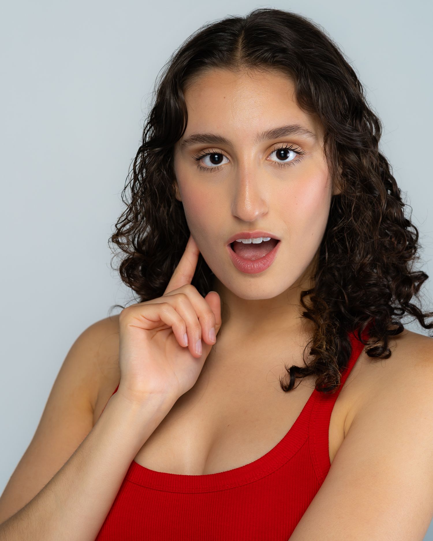 Headshot image of woman looking amazed