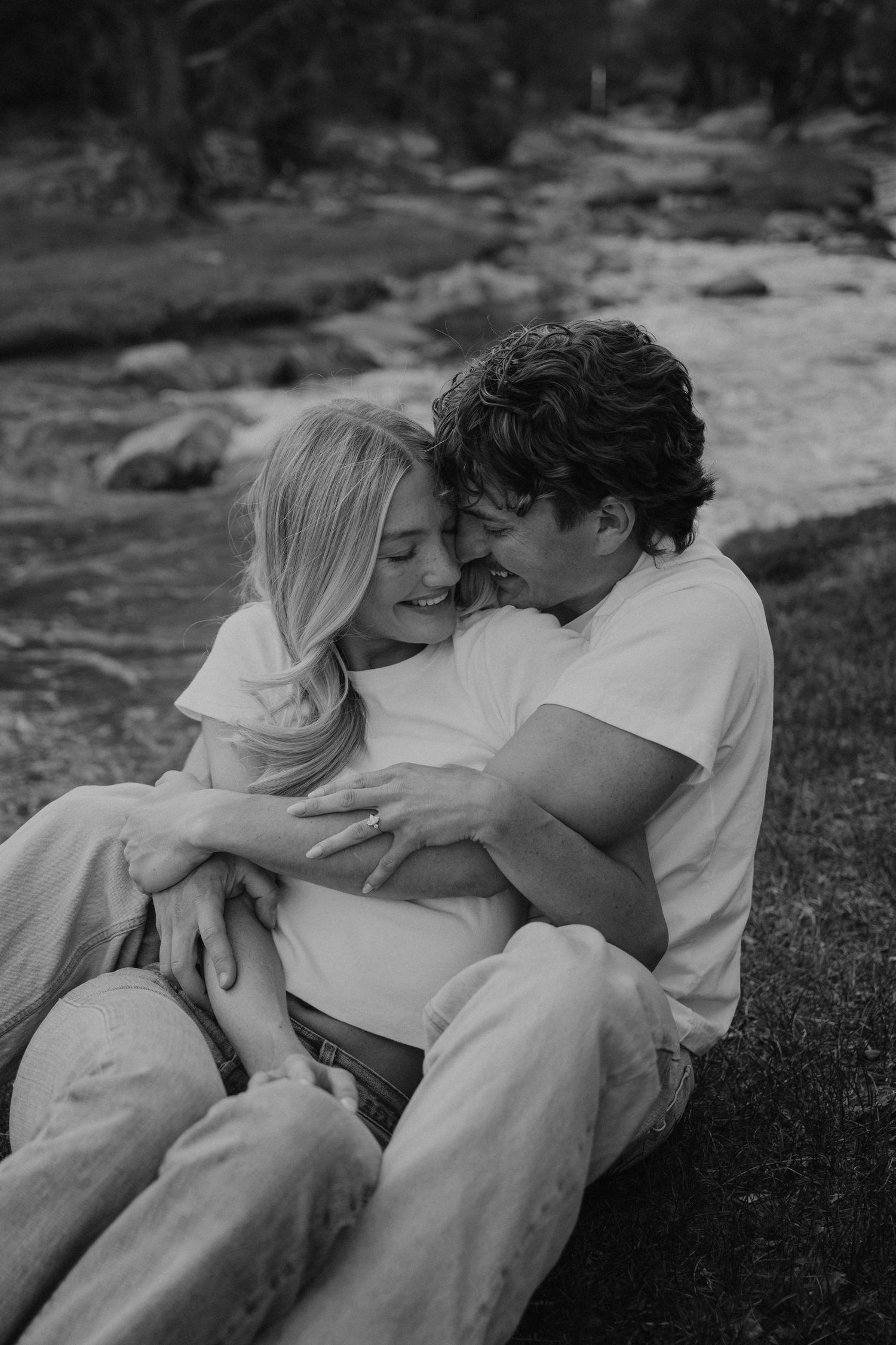 Couple spinning in the utah mountains at sunset for engagement photoshoot