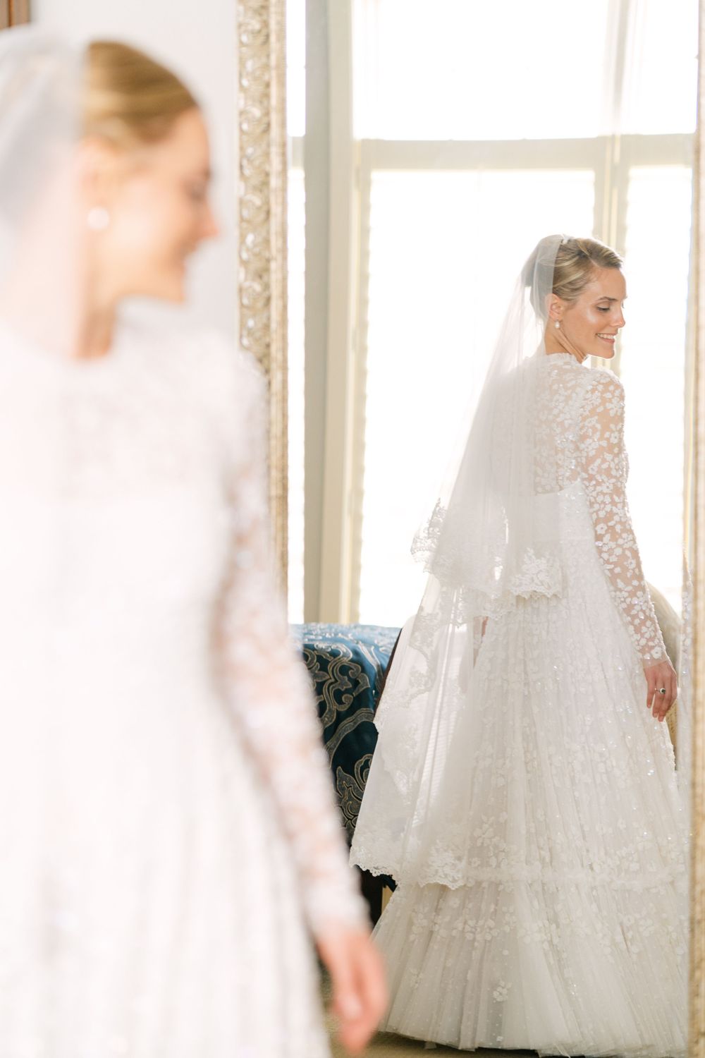 Mirror close up of bride Abby's Needle & Thread London Dress