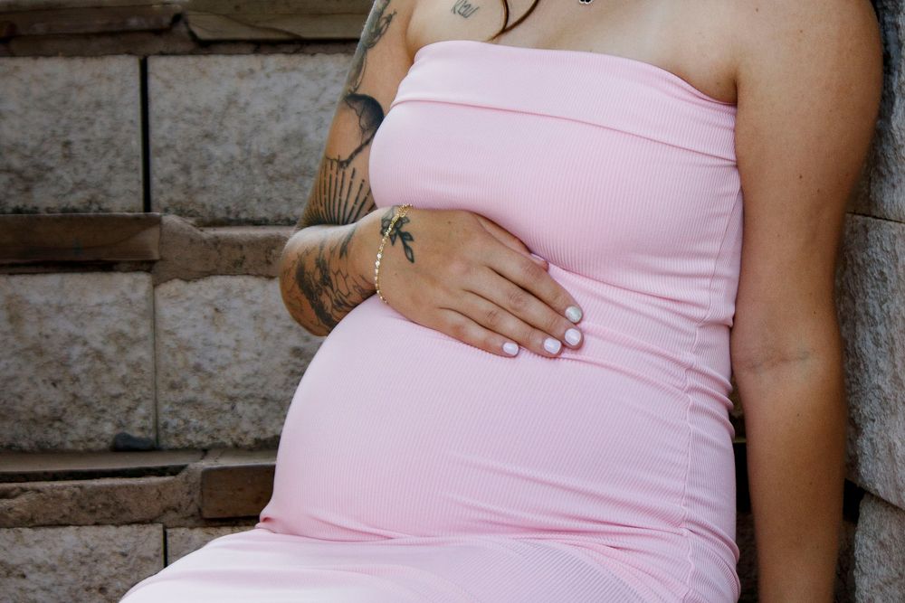 An expecting mother during a maternity photo session at the Botanical Gardens in Amarillo, Texas