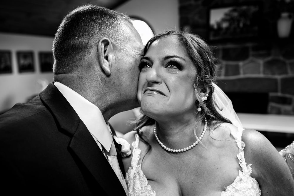 Black and white romantic wedding portraits showing tender moments between newlyweds.