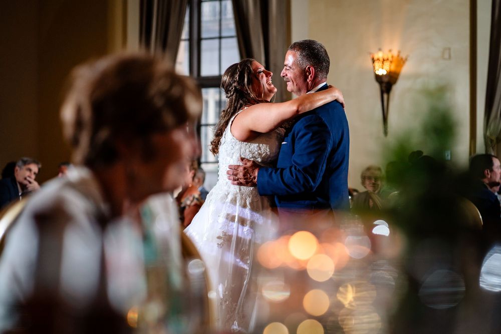 Romantic reception lighting creates intimate atmosphere for wedding celebration.
