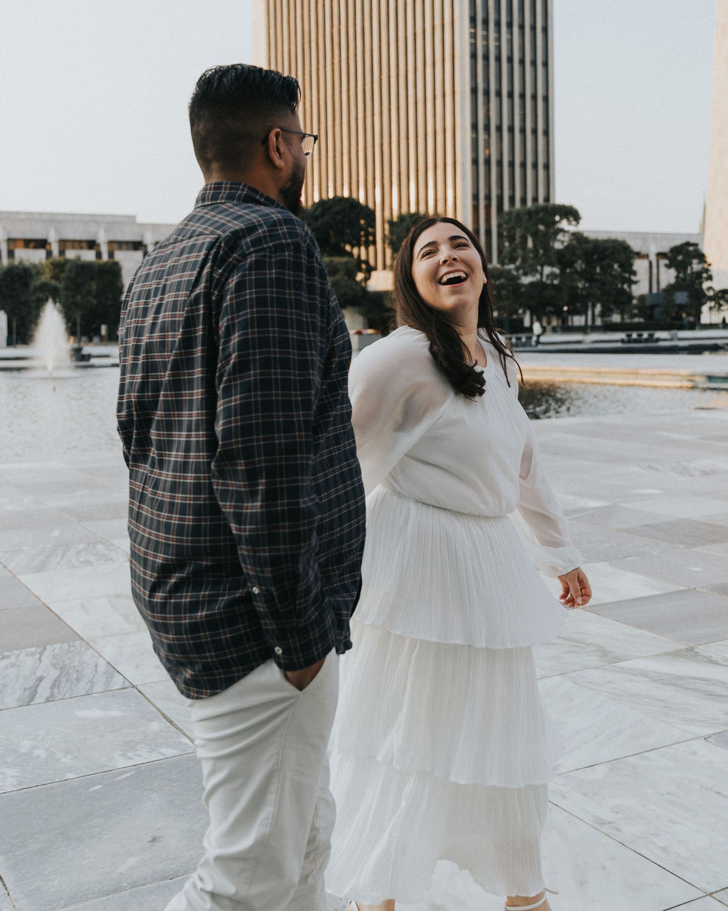 couple holding hands looking at each other