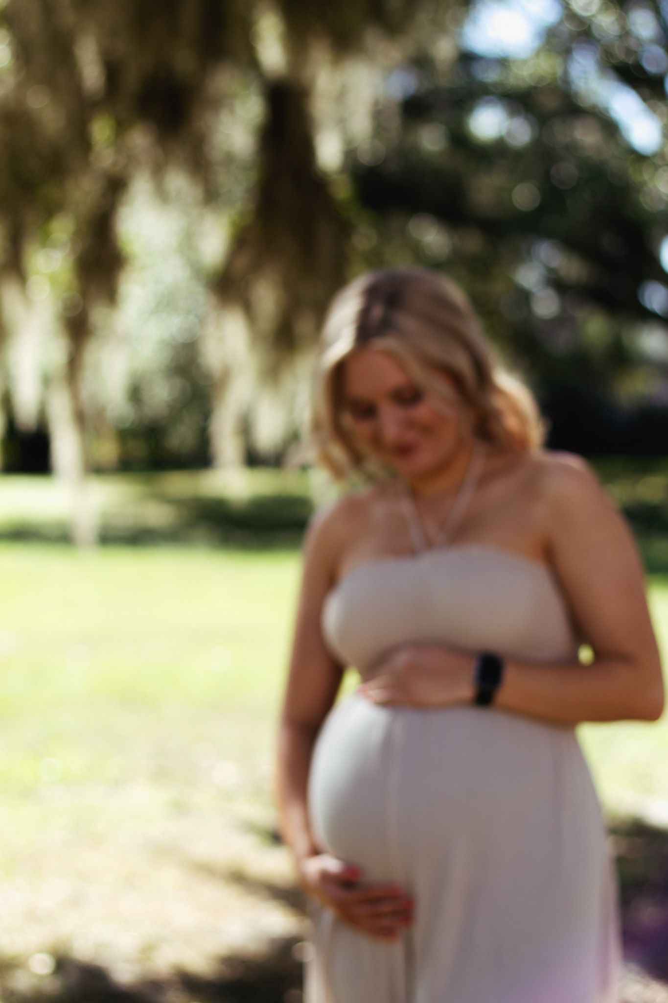 Glowing mom-to-be captured during a maternity photoshoot in Lakeland, Florida.