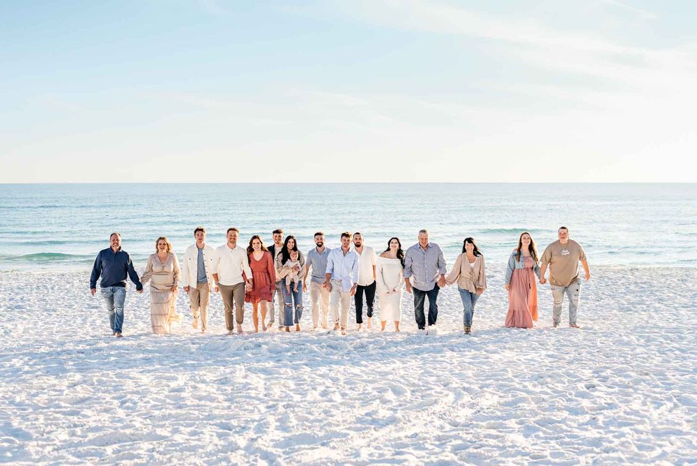 Family photos along the Destin Beach with turquoise blue water and pristine white sandy beaches