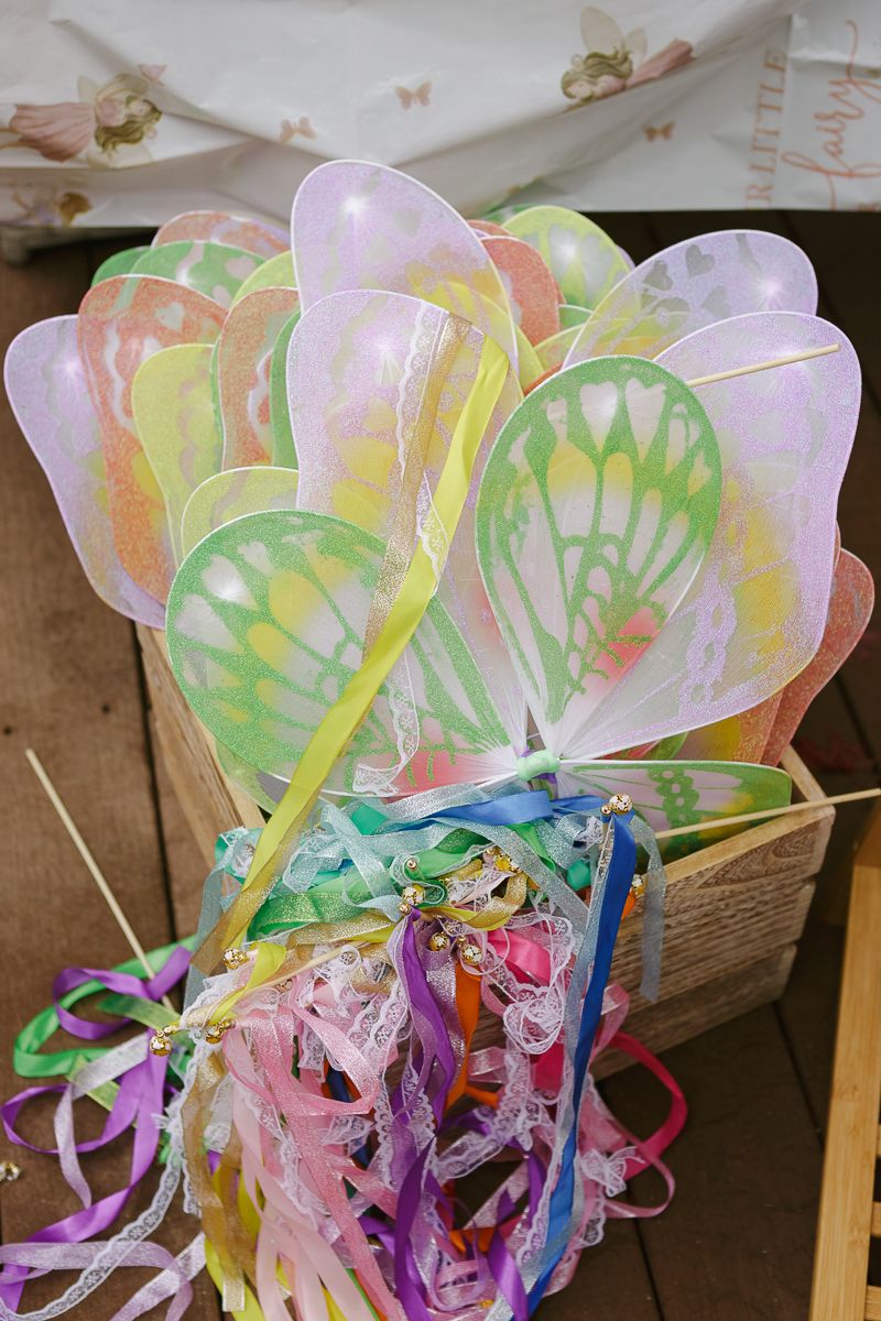 Detail of fairy wings and wands for kids at the birthday party, photographed by NYC family photographer Paula Ortiz