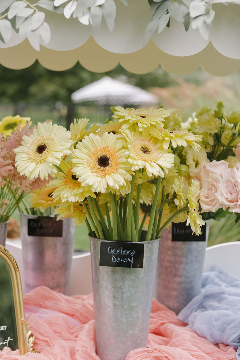 Close-up detail of vibrant flowers at the birthday celebration, by NYC family photographer Paula Ortiz