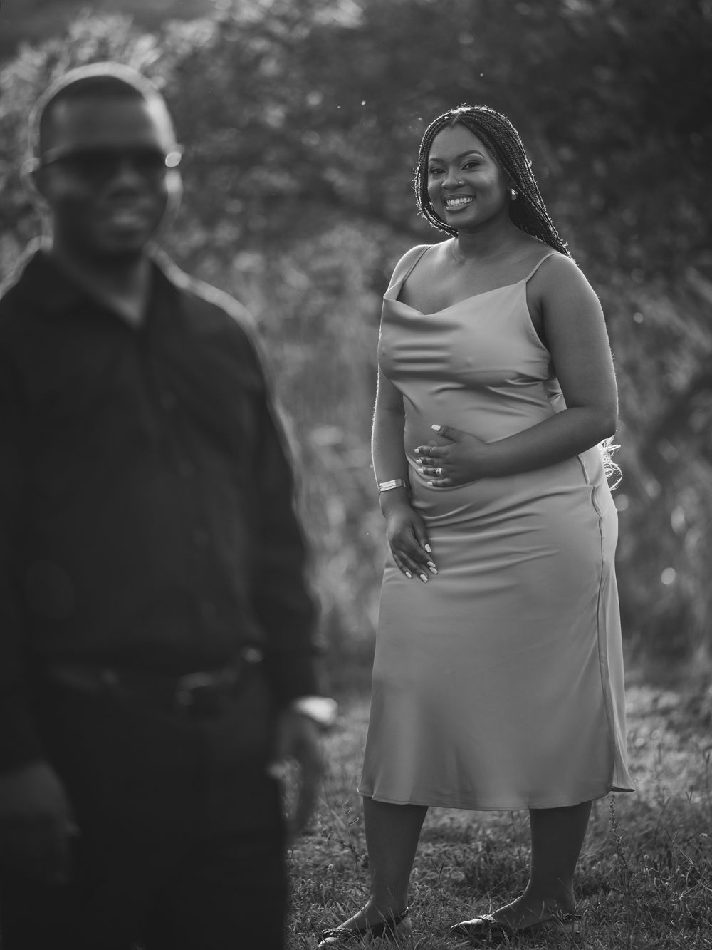 Candid moment captured between couple in natural outdoor setting.
