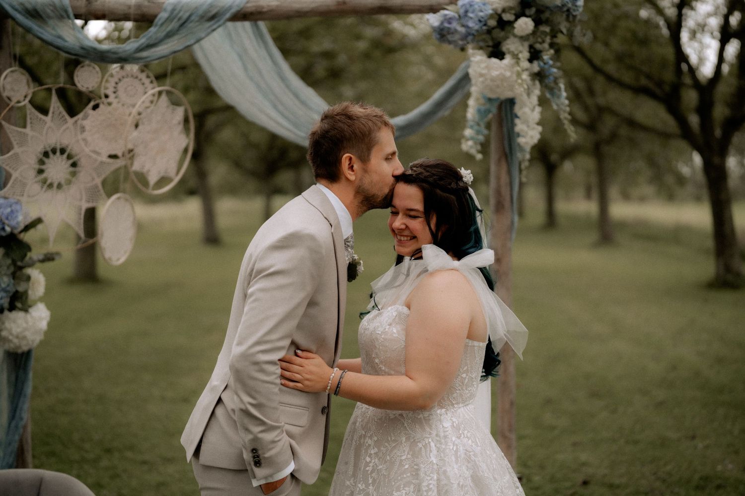 Groom kissing his bride on a emotional moment