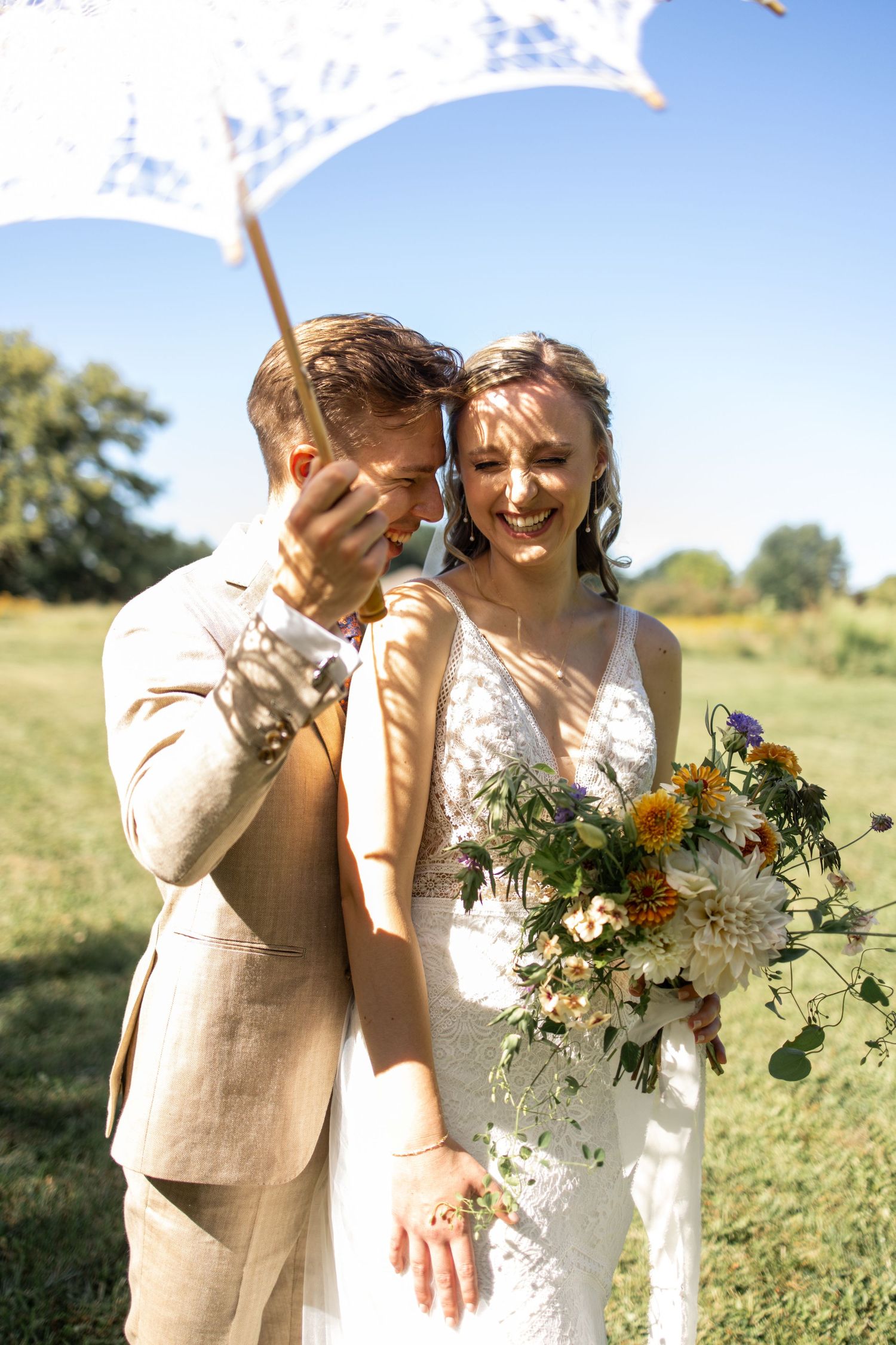 Candid photo of bride and groom with lace parasol in Fort Lauderdale